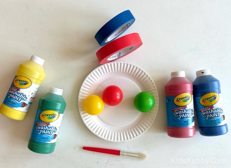 Supplies needed with step by step tutorial on how to make a fun and easy ball toss game for kids. An inexpensive indoor activity to play at home when bored! Just perfect for a rainy day inside. 