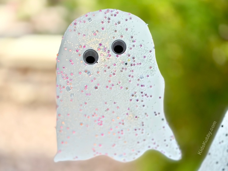 Easy homemade window decorations for Halloween using just Elmer's glue and glitter. Halloween glue ghosts are fun and simple to make with cheap dollar store supplies. 