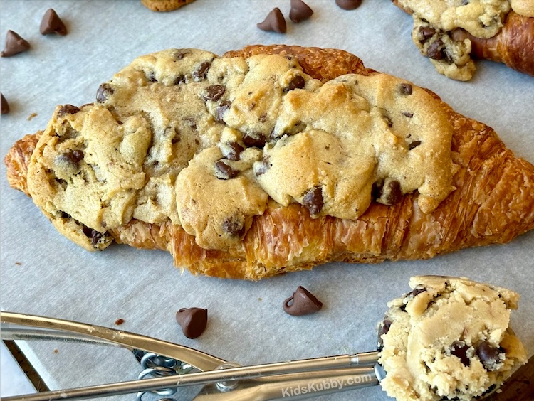 A baked croissant covered in gooey cookie dough is the best dessert you'll ever make. Just two ingredients for the best dessert ever. 