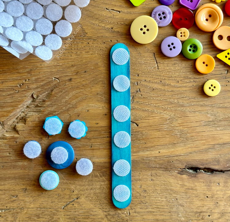 How to turn popsicle sticks and buttons into a fun game for toddlers and preschoolers. 