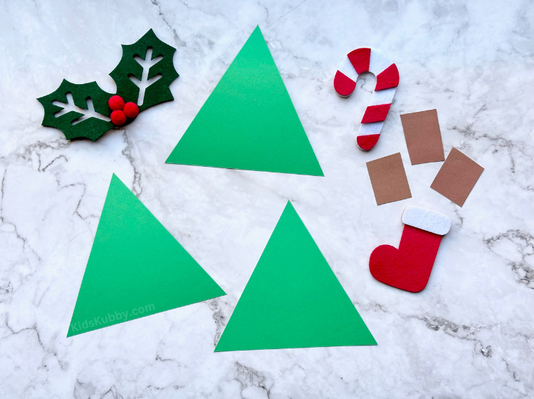 This may be the easiest learning activity you ever make for your kids. With just a few cheap supplies, you can make a fun Christmas tree counting game that helps kids with number recognition and fine motor skills. The best learning game for the holidays. 