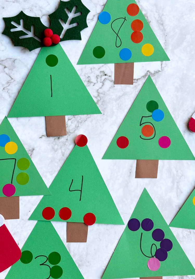 Check out this fun and educational counting game for preschoolers? This is the perfect way to teach number recognition to kids ages 3-5. You probably already have the craft supplies you need at home to make the best Christmas tree counting activity ever. 