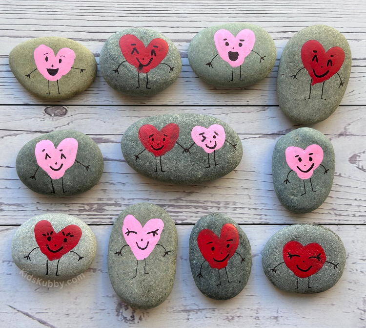 Are you looking for easy homemade Valentine's for your child's classroom this year? These painted fingerprint heart rocks are so easy to make and they are absolutely adorable! This is a fun art project to do with your kids this year. You can even use these painted rocks for yard art or friendship gifts! Easy DIY Valentine's Day craft for kids. 